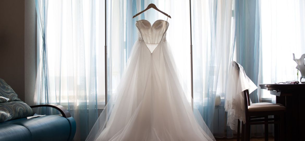 The perfect wedding dress with a full skirt on a hanger
